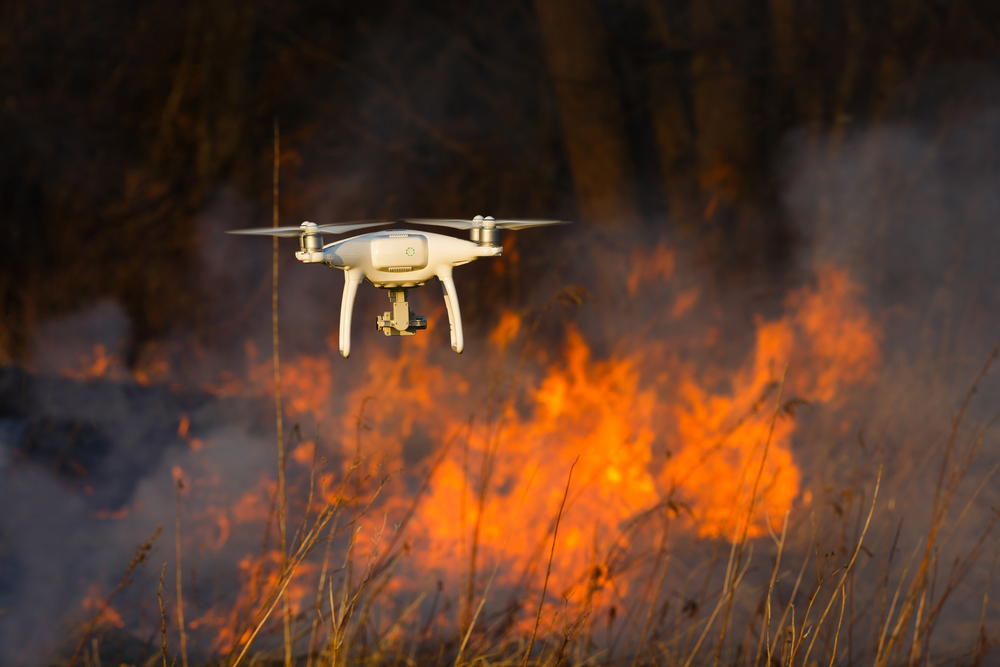 The,Drone,Flies,Against,The,Background,Of,A,Spring,Forest